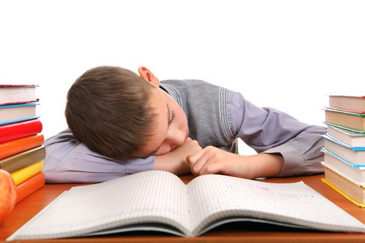 Tired Boy Sleeping on the School Desk on the white background