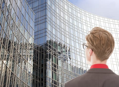 Young man looking at business office