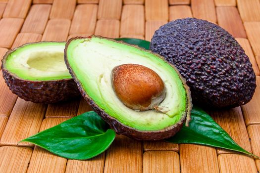 Composition of several avocados on a wood background