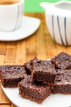 Chocolate brownies with coffee, selective focus