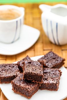 Chocolate brownies with coffee, selective focus