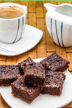 Chocolate brownies with coffee, selective focus
