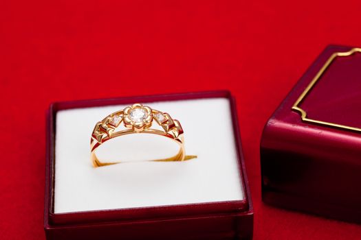 Fantastic gold ring adorned with several white zirconia