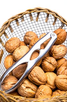 A composition of walnuts and a nutcraker