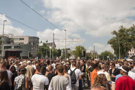 crowd people on the street during dance event in the summer
