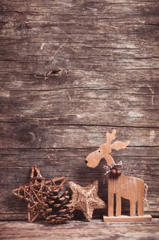 Natural christmas decor - deer over wooden background