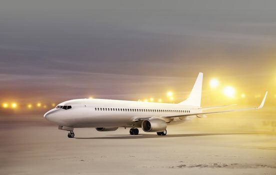 white plane in airport at non-flying weather, blowing snow