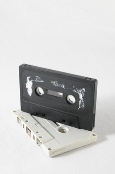 Ancient Vintage Used Musicassette over a White Background
