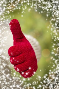 Woman in Sweater with Seasonal Red Mittens Holding Out a Thumbs Up Sign with Snow Flakes Border.