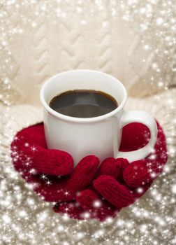 Woman in Sweater with Seasonal Red Mittens Holding a Warm Cup of Coffee with Snow Flakes Border.