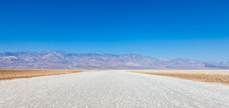 USA, Death Valley. Badwater point: salt road in the middle of the desert