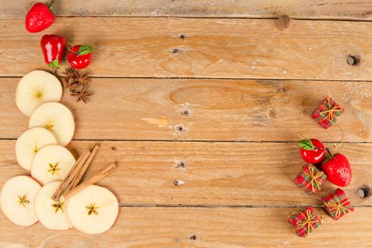 Sliced apples in a still life with cinnamon sticks