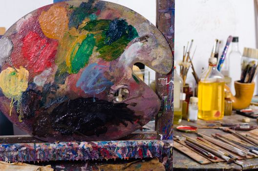 Palette against  the  background of an artists atelier