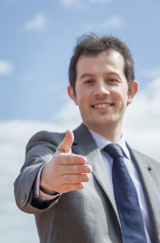 Closeup of business man showing his open hand ready for seal a deal