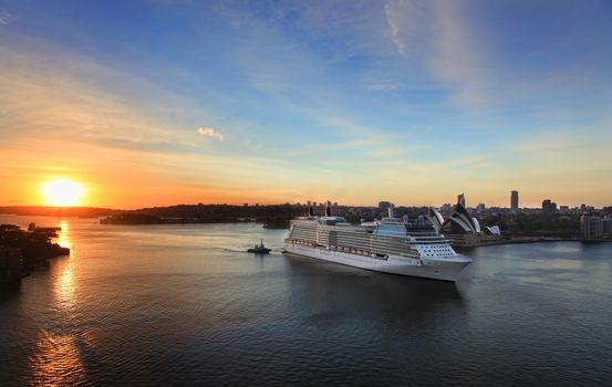 Sydney, Australia - November 28, 2013:  Celebrity Solstice, one of Australia's highest rated superliners sails into Sydney Harbour at sunrise.