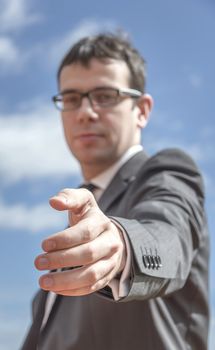 Closeup of business man showing his open hand ready for seal a deal