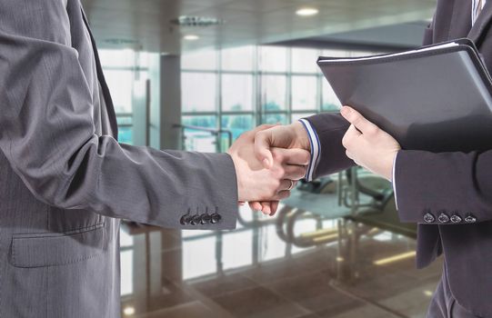 Closeup of a business handshake for closing deal