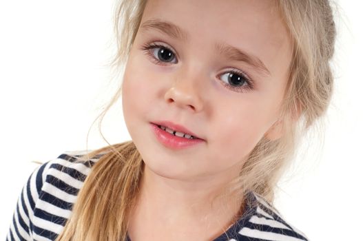 Studio portrait of little cute girl in striped top