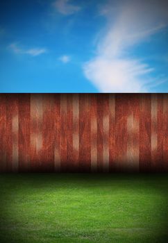 abstract tranquil scene, backyard with wooden fence and green fresh turf