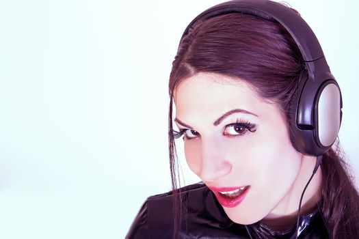 portrait of beautiful DJ girl with headphones