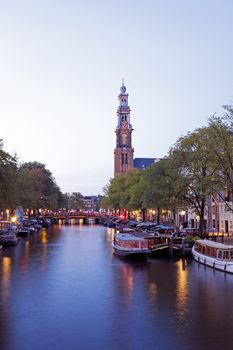 Amsterdam by night with the Westerkerk in the Netherlands