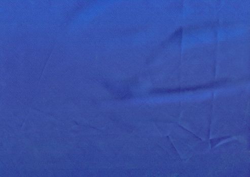 Texture of dark blue satin fabric