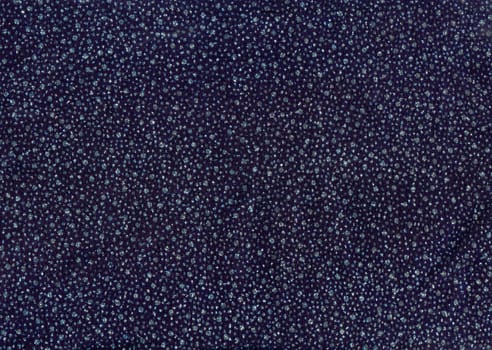 Texture of dark blue cloth with silver and blue sequins as background