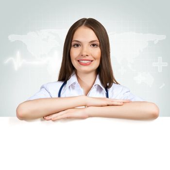 Young attractive female doctor put her hands on the blank banner, place for text