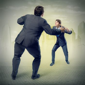 two businessmen fighting as sumoists, the concept of competition in business