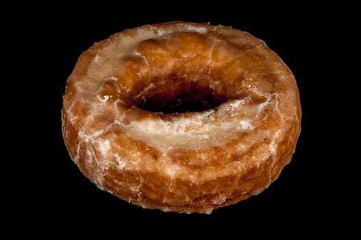 Glazed Donut Isolated on a Black Background