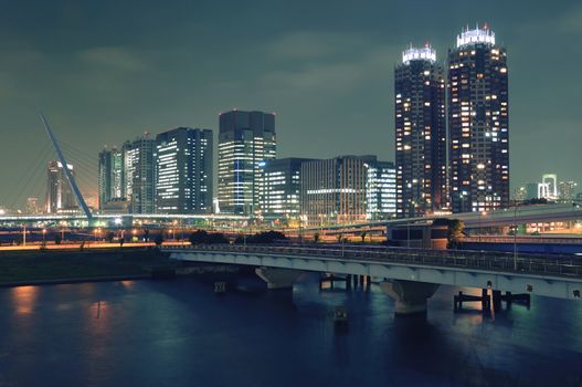 modern Odaiba district buildings in Tokyo Japan by night illumination