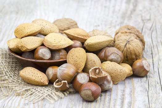 nuts on old wooden background