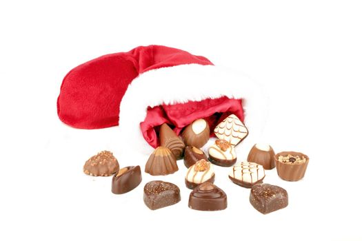 Chocolate and santa hat on a white background