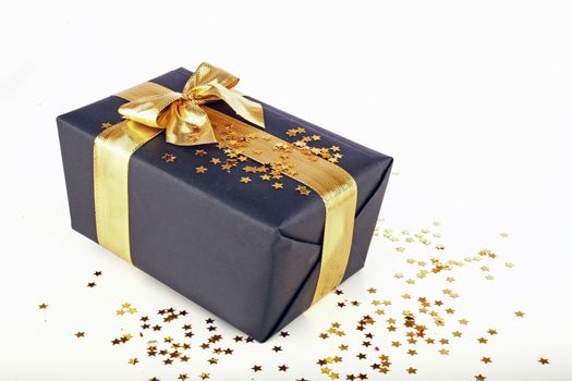 Christmas present with golden ribbon