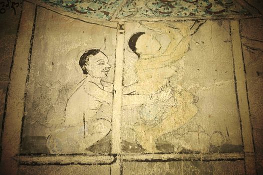 Public mural painting at old temple in Thailand