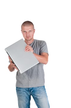 Man in casual clothing holding a laptop on his hands, isolated