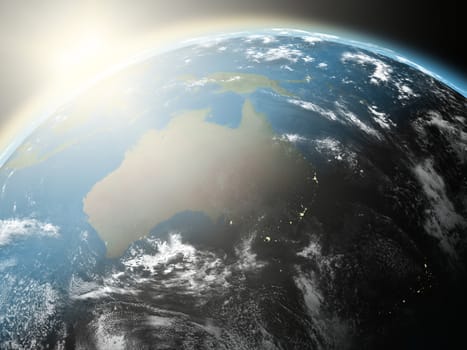 Space view of the sun rising over Australia on planet Earth. Elements of this image furnished by NASA.