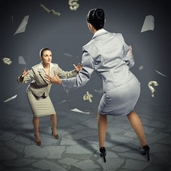 two businesswomen fighting as sumoists, the concept of competition in business