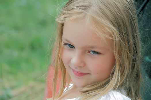Portrait of beautiful girl with blue eyes