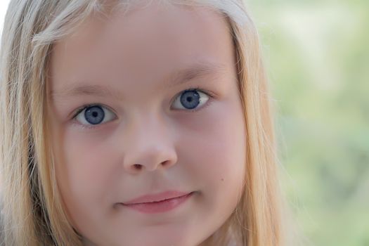 Portrait of beautiful girl with blue eyes