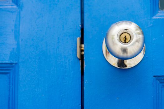 Stainless handle on blue wooden door3