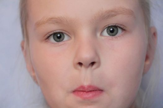 Portrait of beautiful girl with blue eyes
