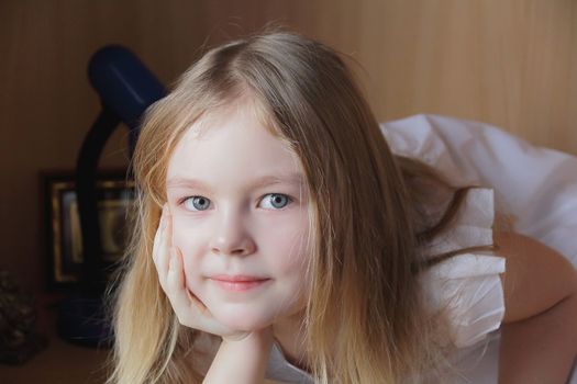 Portrait of beautiful girl with blue eyes