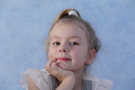 Portrait of beautiful girl with blue eyes