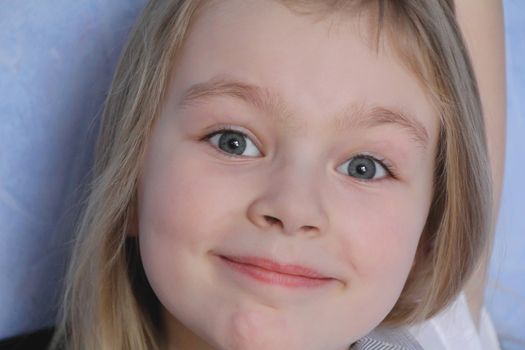 Portrait of beautiful girl with blue eyes