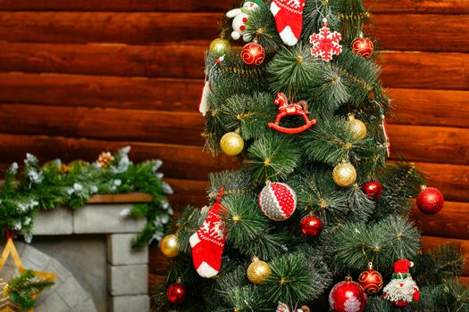 Christmas tree decorated with toys and gifts photographed closeup