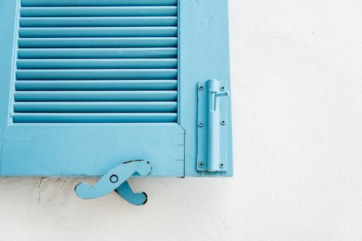 Blue wooden window on white wall2