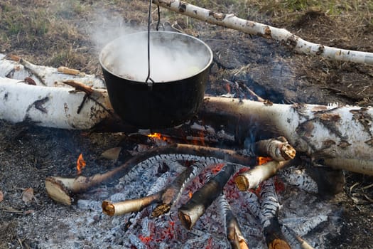 Cooking dinner in field conditions at the  bonfire