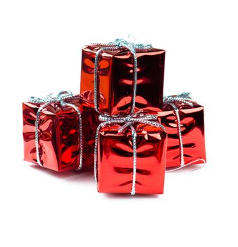 Closeup view of vibrant red christmas decorations in gift boxes shape