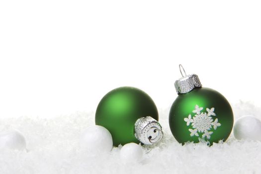 christmas, decoration with christmas bauble green on snow 